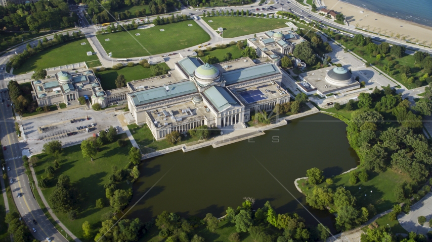 A view of the Museum of Science and Industry, Hyde Park, Chicago, Illinois Aerial Stock Photo AX0001_009.0000328F | Axiom Images