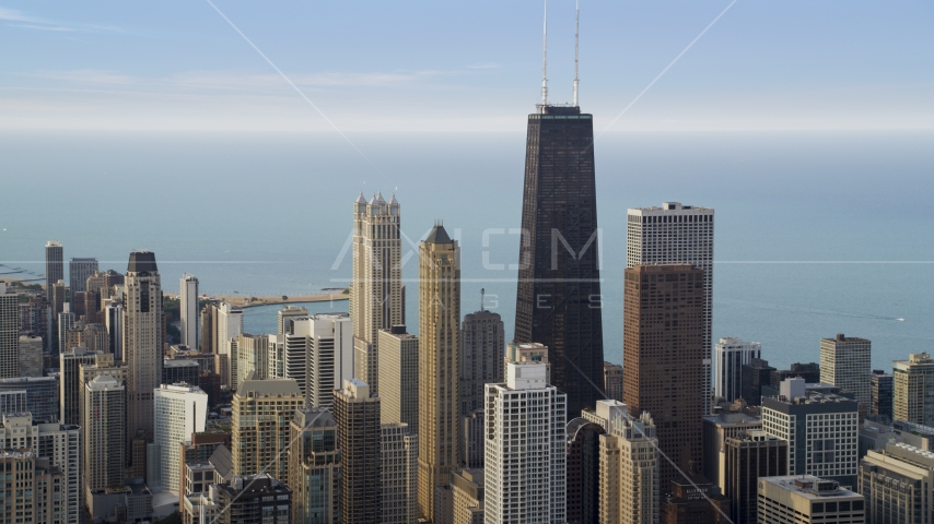 Skyscrapers around John Hancock Center in Downtown Chicago on a hazy day, Illinois Aerial Stock Photo AX0001_054.0000000F | Axiom Images