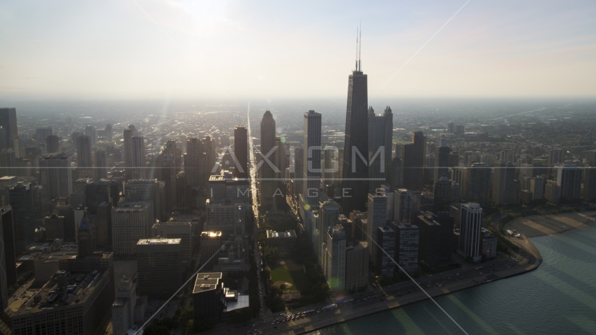 John Hancock Center and skyscrapers seen from the lake, Downtown Chicago, Illinois Aerial Stock Photo AX0001_091.0000000F | Axiom Images