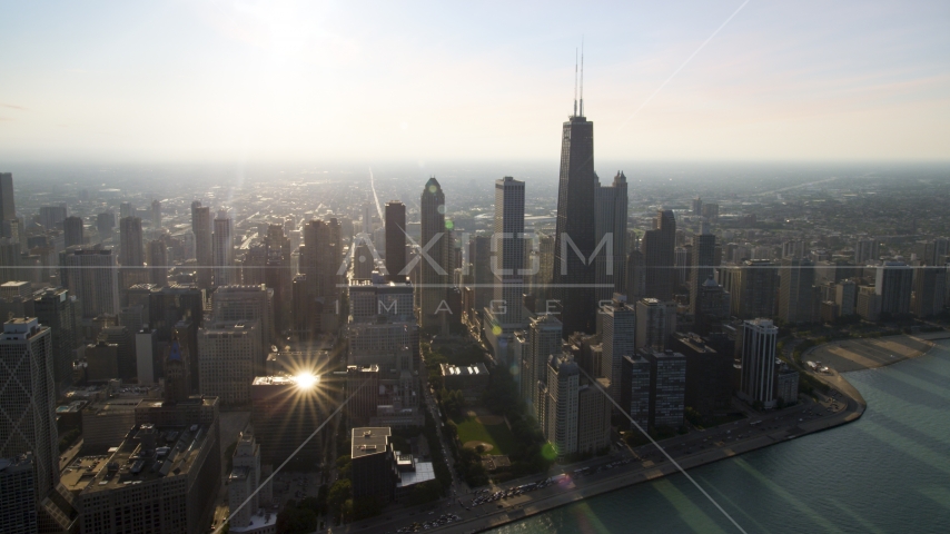 A view of John Hancock Center and skyscrapers seen from the lake, Downtown Chicago, Illinois Aerial Stock Photo AX0001_091.0000055F | Axiom Images