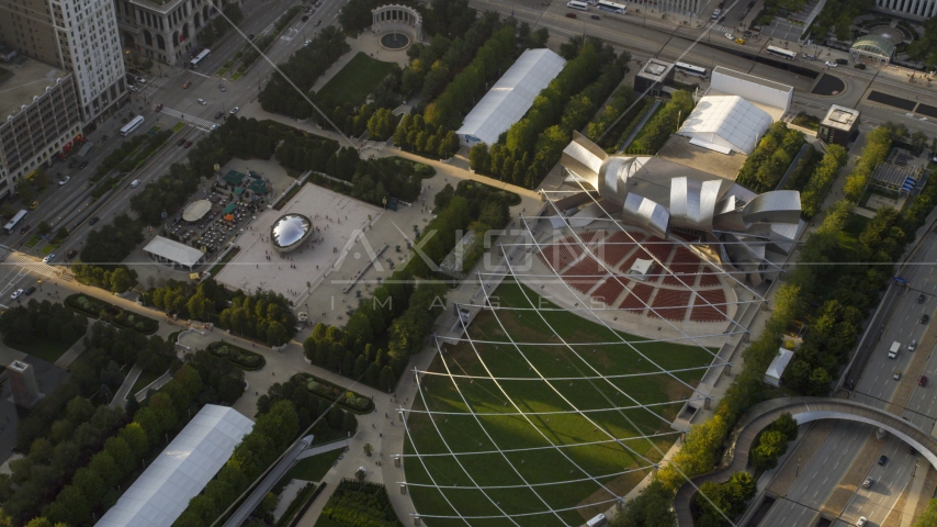 The Cloud Gate sculpture at AT&T Park and Jay Pritzker Pavilion, Grant Park, Downtown Chicago, Illinois Aerial Stock Photo AX0001_104.0000031F | Axiom Images