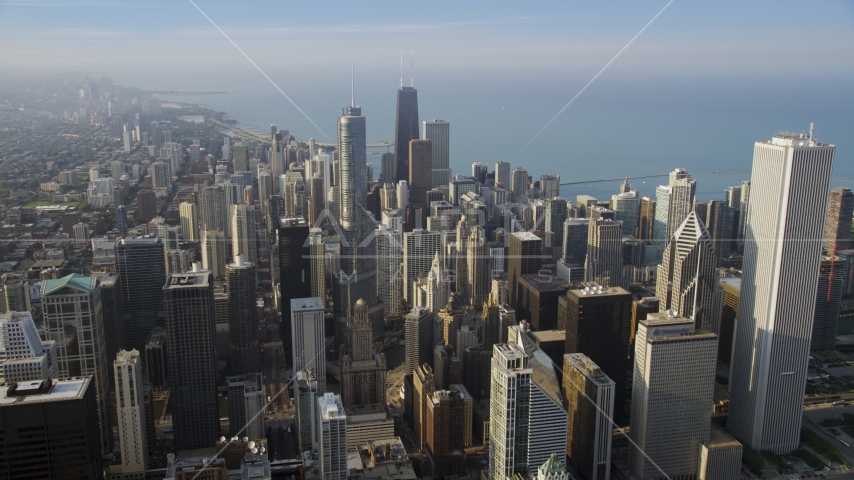 Tall skyscrapers near the lake in Downtown Chicago, Illinois Aerial Stock Photo AX0001_115.0000212F | Axiom Images