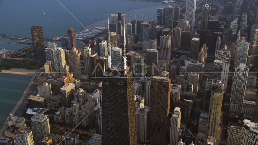 The top of John Hancock Center and downtown Chicago skyscrapers, Illinois Aerial Stock Photo AX0001_128.0000011F | Axiom Images