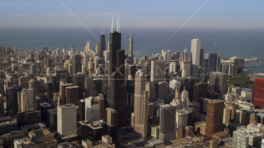 Downtown Chicago cityscape and the iconic Willis Tower skyscraper, Illinois Aerial Stock Photo AX0002_064.0000209F | Axiom Images