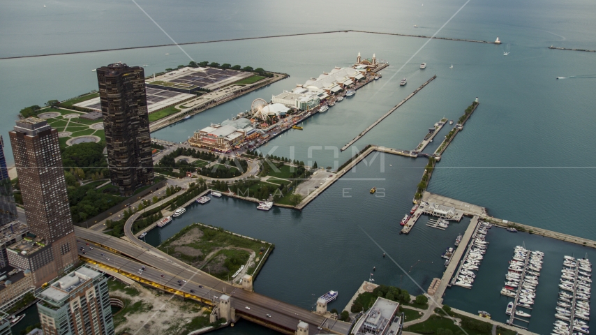 Navy Pier and Lake Michigan at sunset in Downtown Chicago, Illinois Aerial Stock Photo AX0003_061.0000464F | Axiom Images