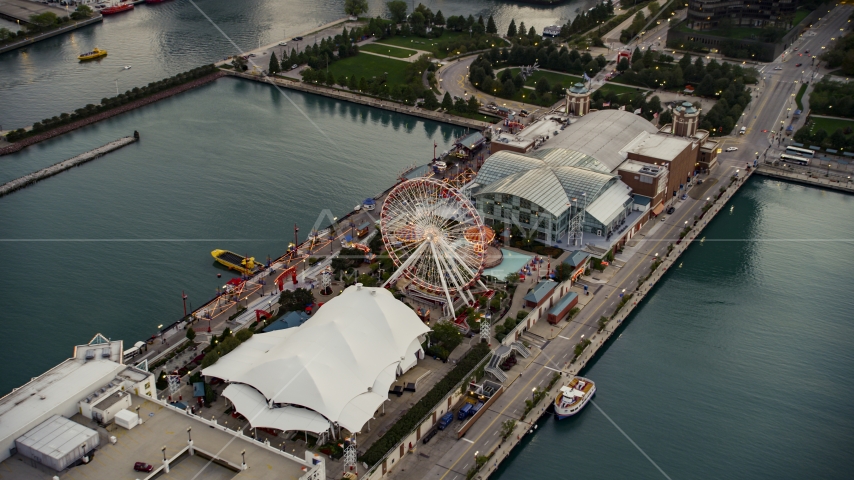 Ferris wheel and amusement park rides on Navy Pier at sunset, Chicago, Illinois Aerial Stock Photo AX0003_068.0000069F | Axiom Images