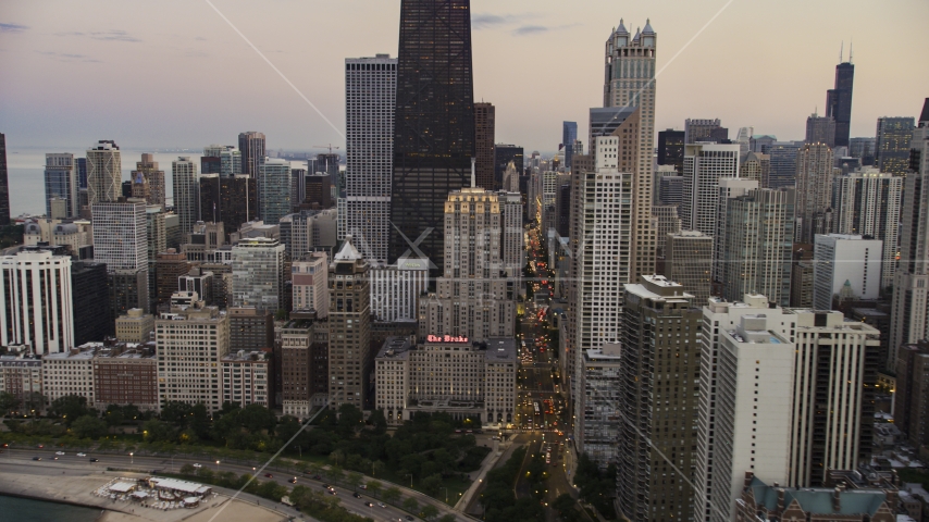 The Drake Hotel by John Hancock Center at twilight, Downtown Chicago, Illinois Aerial Stock Photo AX0003_075.0000318F | Axiom Images