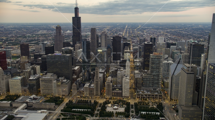 Willis Tower and skyscrapers seen from Grant Park in Downtown Chicago, Illinois, twilight Aerial Stock Photo AX0003_081.0000167F | Axiom Images