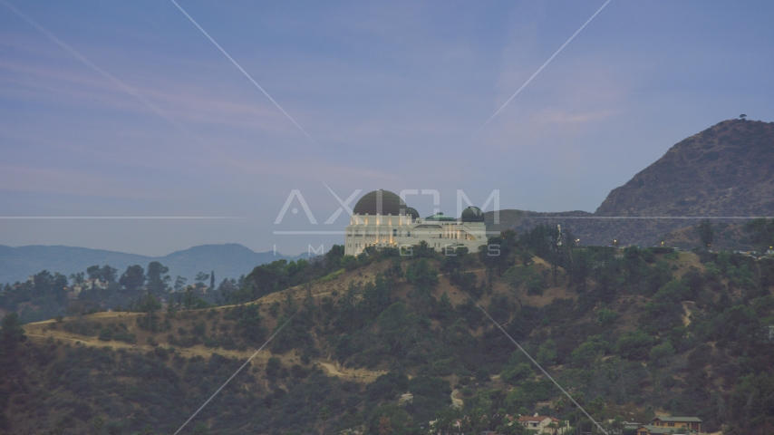 Griffith Observatory at twilight in Los Angeles, California Aerial Stock Photo AX0158_007.0000416 | Axiom Images