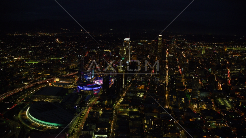 The convention center, Staples Center, and skyscrapers at night, Downtown Los Angeles, California Aerial Stock Photo AX0158_083.0000000 | Axiom Images