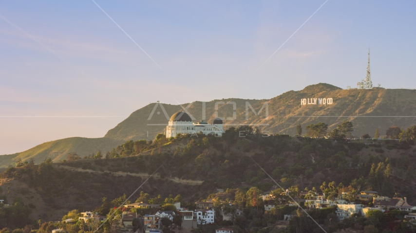 Griffith Observatory with the Hollywood Sign in the background in Los Angeles, California Aerial Stock Photo AX0162_052.0000333 | Axiom Images