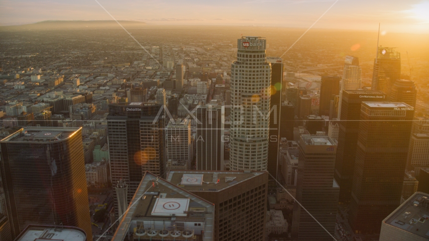 US Bank Tower and skyscrapers at sunset in Downtown Los Angeles, California Aerial Stock Photo AX0162_082.0000322 | Axiom Images