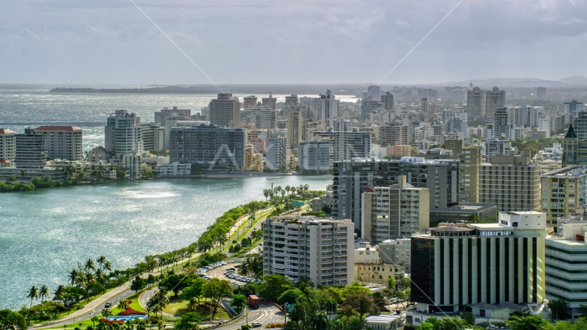 Waterfront Apartment Buildings in the rain, San Juan Puerto Rico Aerial Stock Photo AX101_003.0000000F | Axiom Images