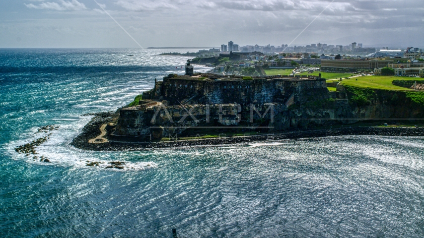 Historic fort on the coast with clear blue water, Old San Juan, Puerto Rico Aerial Stock Photo AX101_015.0000000F | Axiom Images