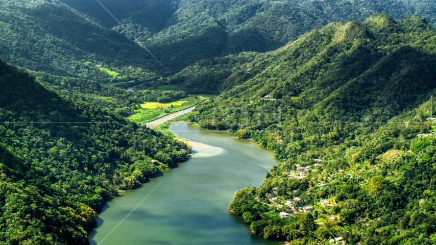 Lakefront homes and lush green forests, Lago Dos Bocas, Karst Forest, Puerto Rico Aerial Stock Photo AX101_072.0000000F | Axiom Images