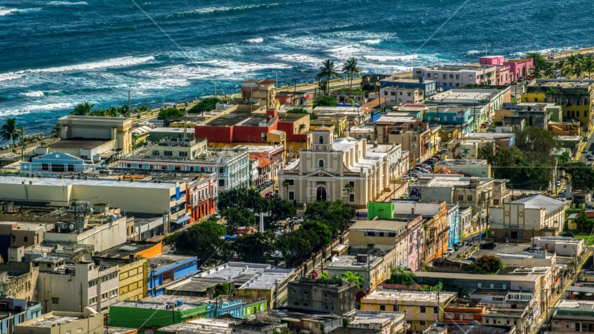 Catedral San Felipe near the Caribbean island coast in Arecibo, Puerto Rico Aerial Stock Photo AX101_137.0000000F | Axiom Images