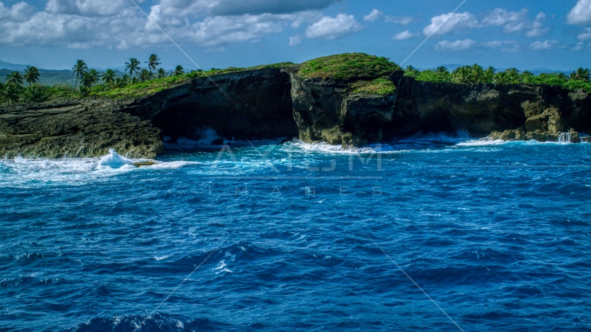 Coastal rock formation and crystal blue water, Arecibo, Puerto Rico  Aerial Stock Photo AX101_165.0000000F | Axiom Images