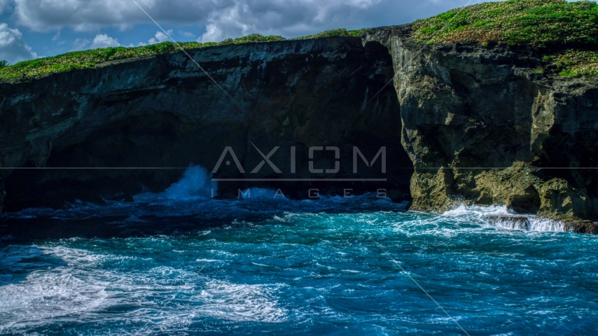 Coastal sea cave in rock formations, Arecibo, Puerto Rico Aerial Stock Photo AX101_166.0000000F | Axiom Images