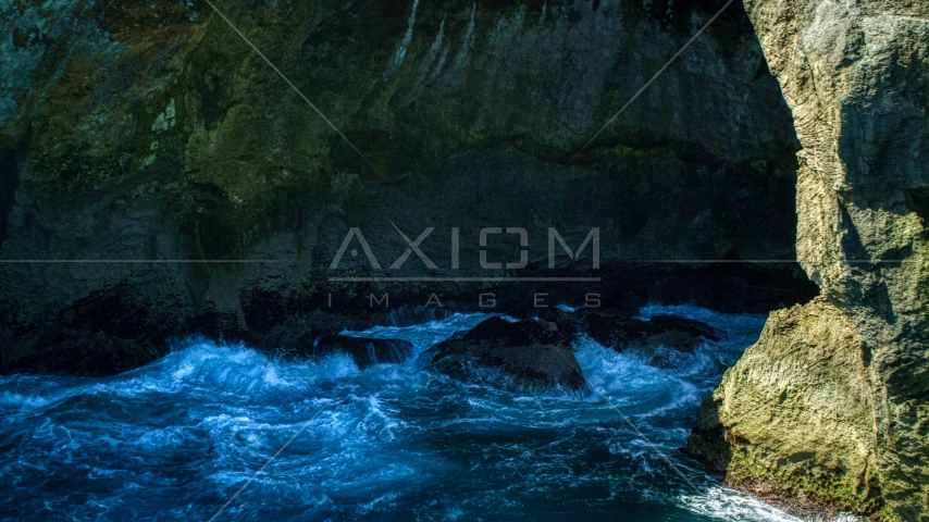 Churning water in a Caribbean sea cave, Arecibo, Puerto Rico Aerial Stock Photo AX101_167.0000000F | Axiom Images