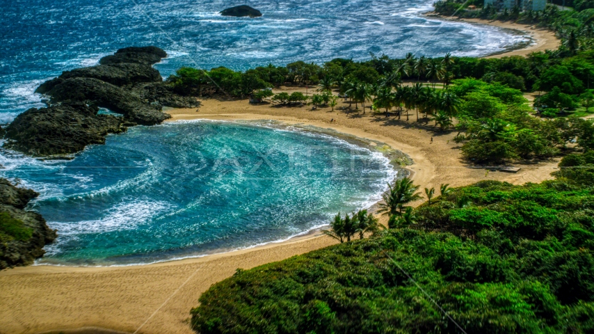 Coastal tide pool and beach in Manati, Puerto Rico  Aerial Stock Photo AX101_190.0000167F | Axiom Images