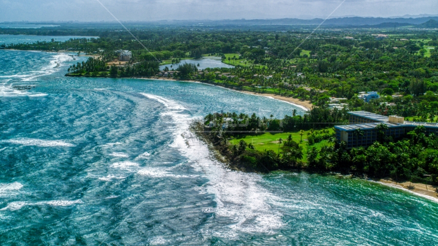 Beachfront island community by blue water, Dorado, Puerto Rico Aerial Stock Photo AX101_213.0000000F | Axiom Images