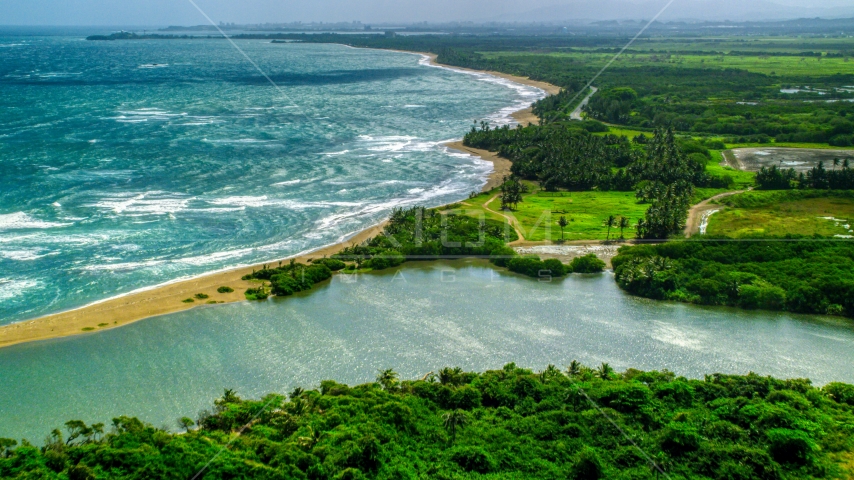 A desert Caribbean island beach and lagoon in Dorado, Puerto Rico  Aerial Stock Photo AX101_220.0000000F | Axiom Images