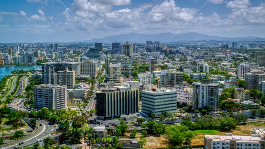 Apartment and office buildings near the water, San Juan, Puerto Rico Aerial Stock Photo AX102_001.0000193F | Axiom Images