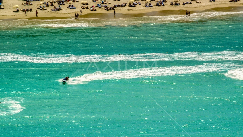 Jet skiers in crystal blue water, Carolina, Puerto Rico  Aerial Stock Photo AX102_009.0000217F | Axiom Images