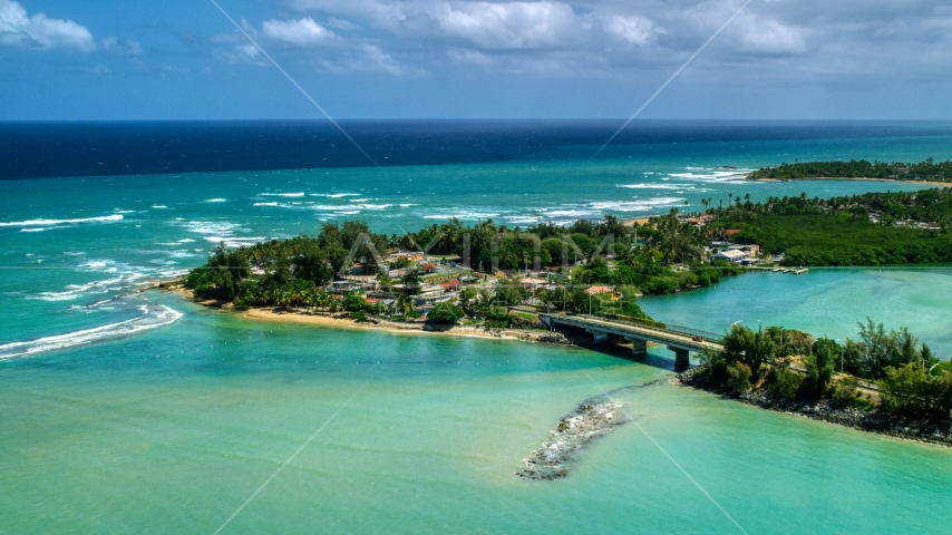 Small island shops beside a small bridge in Loiza, Puerto Rico Aerial Stock Photo AX102_015.0000000F | Axiom Images