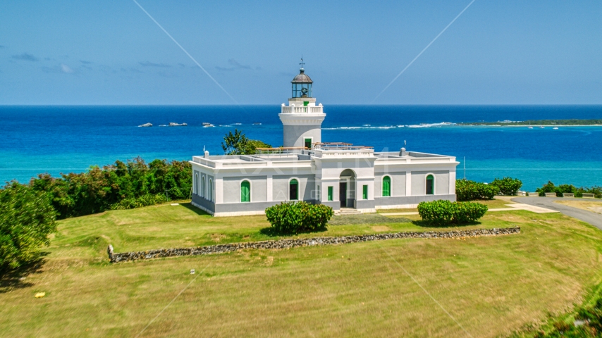 Cape San Juan Light with a view of crystal blue waters, Puerto Rico Aerial Stock Photo AX102_063.0000106F | Axiom Images