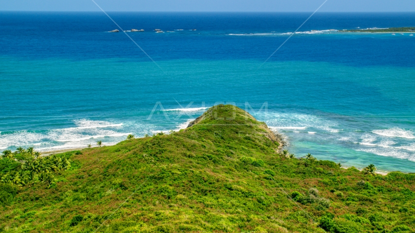 Tiny islands and blue ocean beyond the shore in Puerto Rico Aerial Stock Photo AX102_063.0000200F | Axiom Images