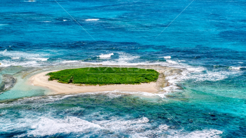 Tiny green island in Caribbean blue waters, Puerto Rico Aerial Stock Photo AX102_086.0000079F | Axiom Images