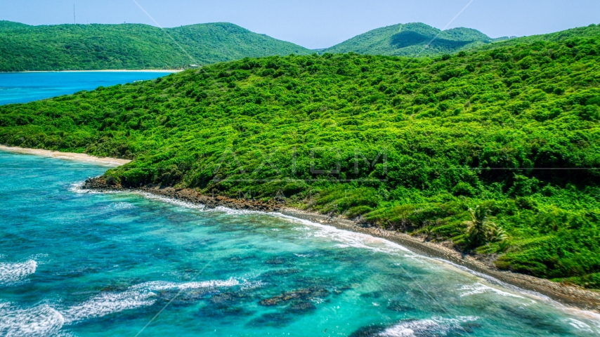 Blue ocean waters and a green island coastline in Culebra, Puerto Rico  Aerial Stock Photo AX102_111.0000000F | Axiom Images