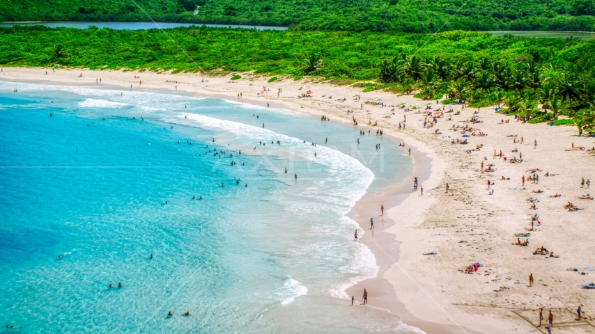 Sunbathers on a white sand Caribbean beach in Culebra, Puerto Rico  Aerial Stock Photo AX102_112.0000187F | Axiom Images