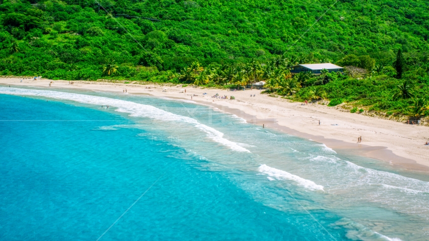 Sapphire blue waters by tourists on a white sand Caribbean beach, Culebra, Puerto Rico  Aerial Stock Photo AX102_113.0000000F | Axiom Images