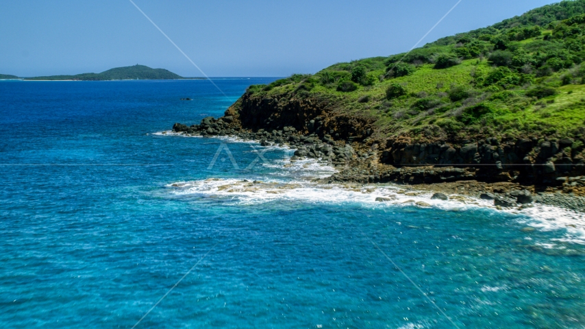 A rugged Caribbean island coast and blue water in Culebra, Puerto Rico  Aerial Stock Photo AX102_128.0000342F | Axiom Images