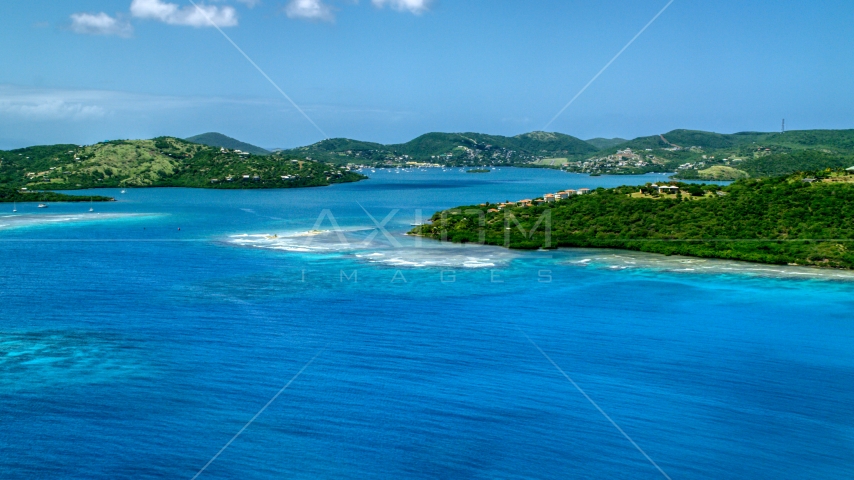 Sapphire blue bay and a coastal island town on Culebra, Puerto Rico  Aerial Stock Photo AX102_139.0000000F | Axiom Images