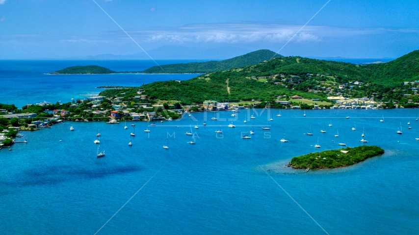 Sail boats in sapphire blue water near a small coastal town, Culebra, Puerto Rico  Aerial Stock Photo AX102_142.0000000F | Axiom Images