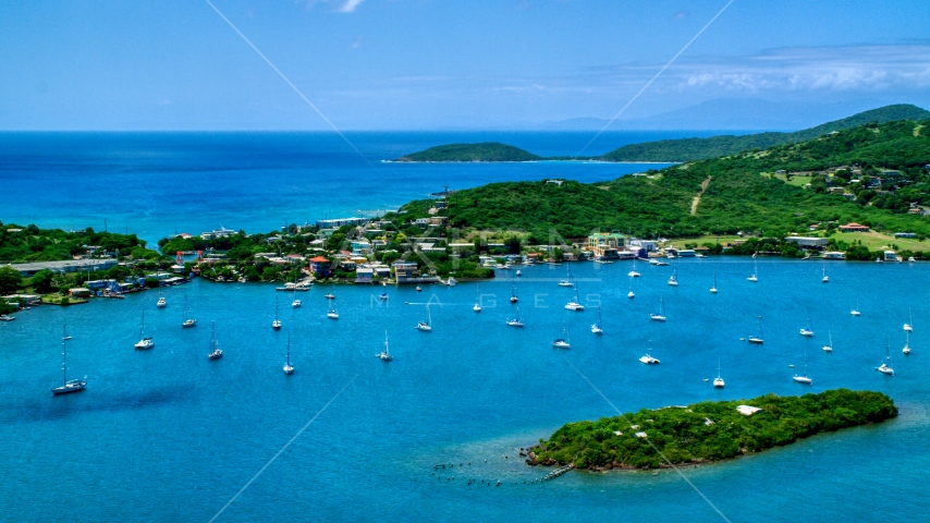 Sailing boats in sapphire blue water near a coastal town, Culebra, Puerto Rico  Aerial Stock Photo AX102_142.0000195F | Axiom Images