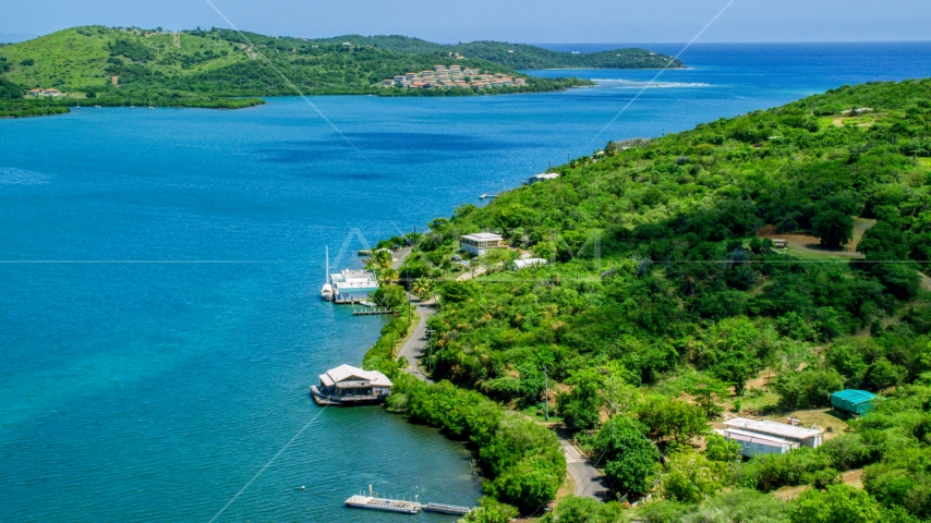 Oceanfront homes along the coast by sapphire waters, Culebra, Puerto Rico  Aerial Stock Photo AX102_153.0000125F | Axiom Images