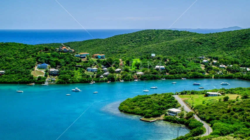 Oceanfront island homes overlooking sapphire waters, Culebra, Puerto Rico Aerial Stock Photo AX102_155.0000000F | Axiom Images