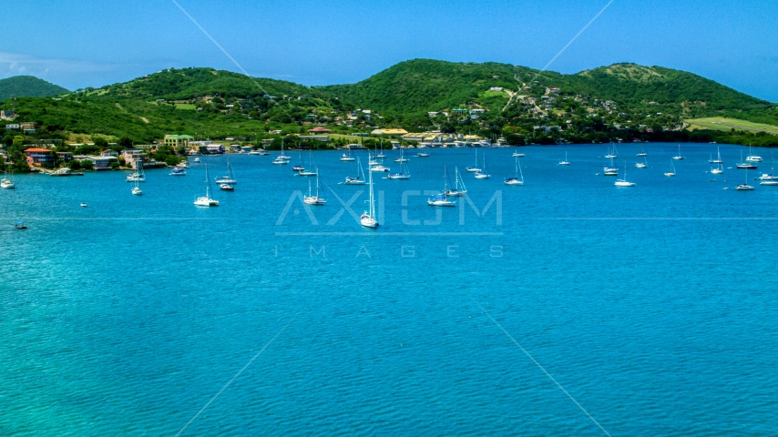 Sailboats in sapphire blue harbor near the coastal island town on Culebra, Puerto Rico  Aerial Stock Photo AX102_161.0000000F | Axiom Images