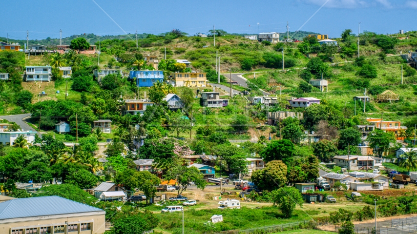 Hillside homes on the Caribbean island of Culebra, Puerto Rico  Aerial Stock Photo AX102_165.0000225F | Axiom Images