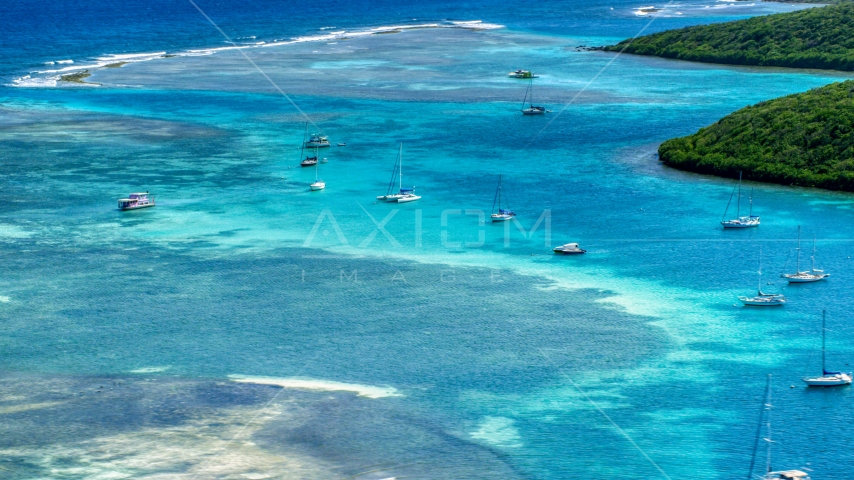 Sailboats anchored in the harbor near reefs in Culebra, Puerto Rico  Aerial Stock Photo AX102_169.0000228F | Axiom Images