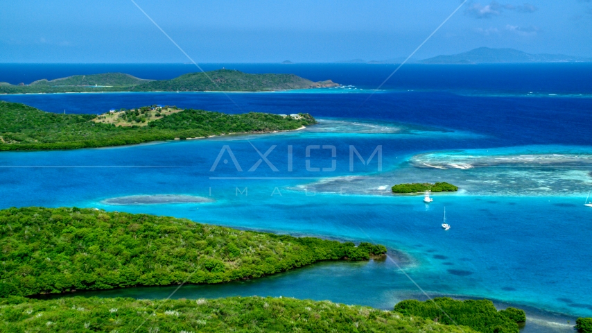 Boats anchored off the Caribbean island coast in Culebra, Puerto Rico Aerial Stock Photo AX102_171.0000213F | Axiom Images