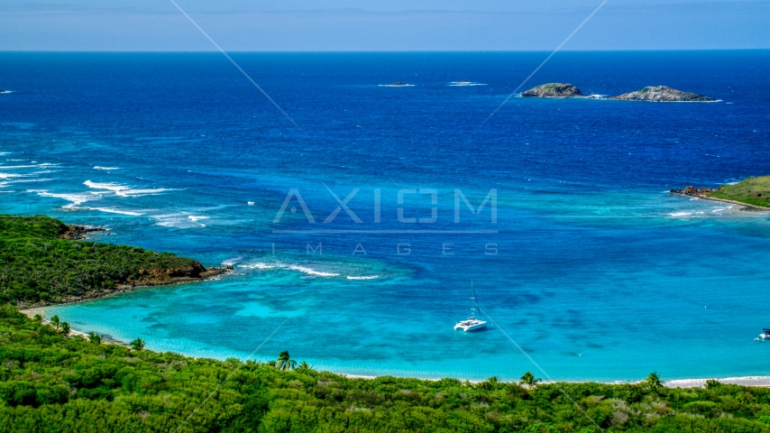 A catamaran near a Caribbean island coast, Culebrita, Puerto Rico  Aerial Stock Photo AX102_178.0000257F | Axiom Images