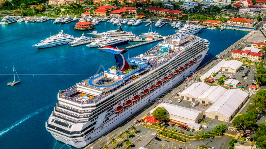 Cruise ship and yachts anchored in sapphire waters of a Caribbean island town, Charlotte Amalie, St. Thomas  Aerial Stock Photo AX102_210.0000272F | Axiom Images