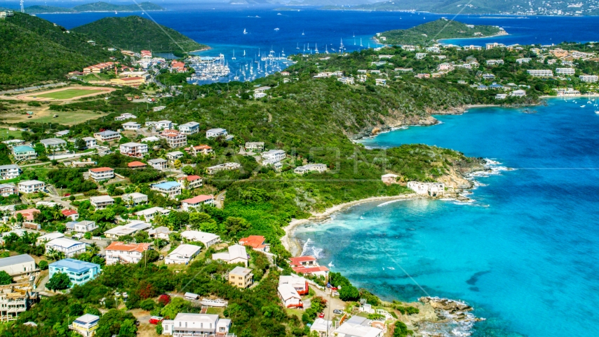 Island homes on the coast near a marina in Red Hook, St Thomas, the US Virgin Islands  Aerial Stock Photo AX102_240.0000000F | Axiom Images