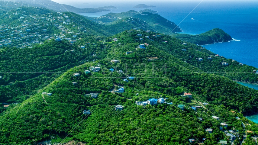 Hilltop island homes over looking the blue ocean waters by the coast, East End, St Thomas  Aerial Stock Photo AX102_259.0000000F | Axiom Images