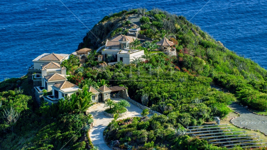 Hilltop mansion with a sapphire blue ocean view, Cruz Bay, St John Aerial Stock Photo AX103_038.0000258F | Axiom Images